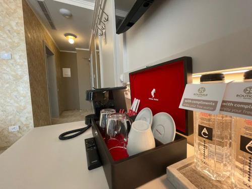 a box sitting on a counter with food in it at Boutique Hotel Balș in Balş
