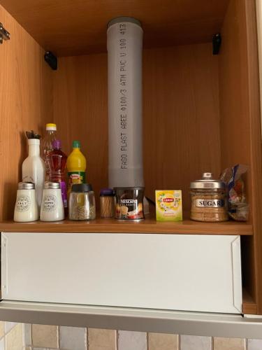 a wooden shelf with food items on it at Chili Seaside 2 in Nea Chili