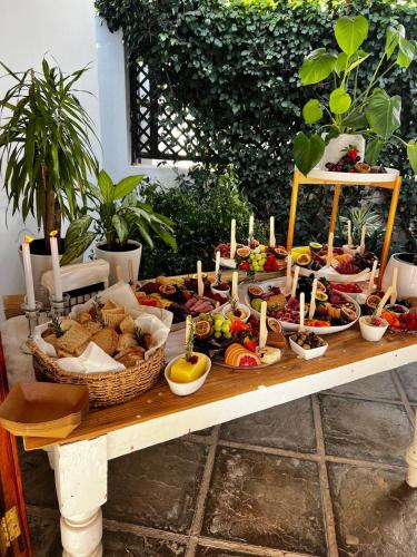 a table with a buffet of food on it at Avoca River Cabins in Addo