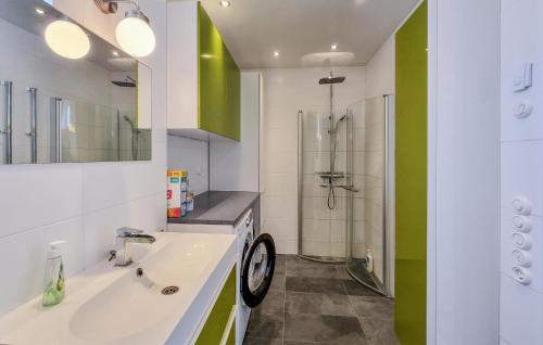 a bathroom with a sink and a shower at Cozy Apartment In Alingsås in Alingsås