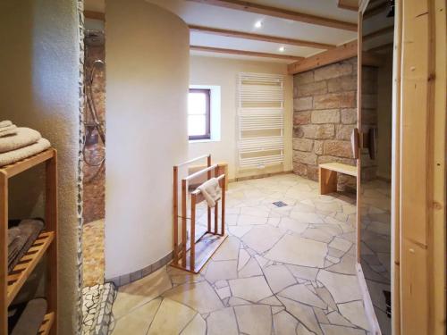 a room with a stone wall and a floor with a staircase at Ferienwohnung Galerie in Bad Schandau