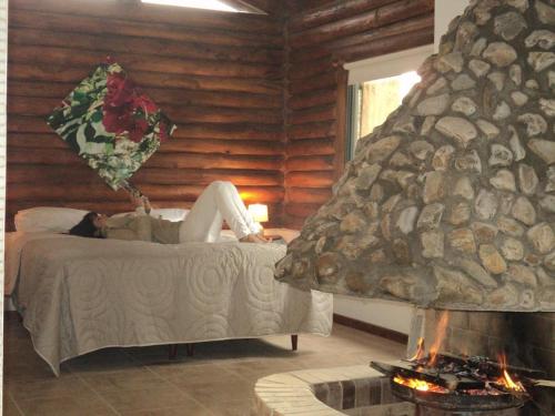 En eller flere senge i et værelse på Cabañas El Secreto