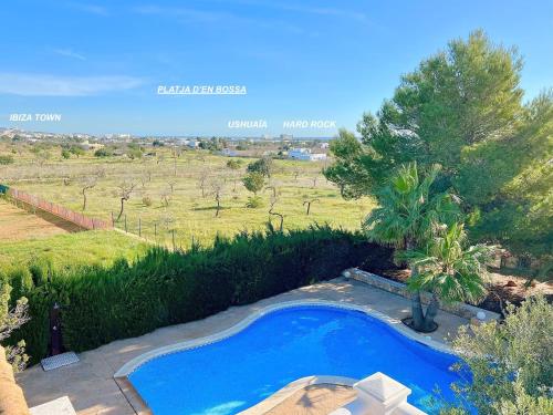 an image of a swimming pool in a field at INIBIZA VILLAS - Villa Oasis in Sant Jordi