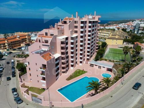 arial view of the apartment building with a swimming pool at Ericeira Beach by AcasaDasCasas in Ericeira