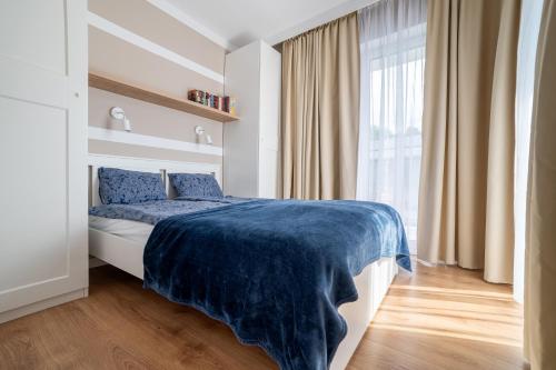 Ένα ή περισσότερα κρεβάτια σε δωμάτιο στο Pobierowo Baltic Apartments A30