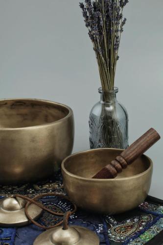 a table with two bowls and a mortar and pestle at Hotel Boutique Santuario Kunturi - Adults Only in Llanes