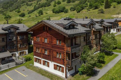 an aerial view of a large wooden building at Haus Birke - Alpenglück in Obergesteln
