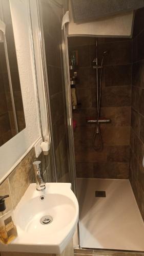 a bathroom with a sink and a shower at Casa Salud in Piera