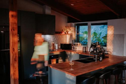 a kitchen with a bar with a counter top at Healesville Mud Brick Hideaway in Healesville