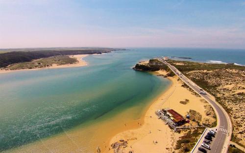 an aerial view of a beach and a highway at Vicentina Rooms & Apartments - Duna Parque Group in Vila Nova de Milfontes