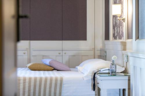 Ένα ή περισσότερα κρεβάτια σε δωμάτιο στο Europa Hotel Design Spa 1877
