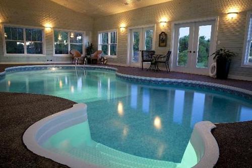 a large swimming pool in a large house at Graham Inn in New Glasgow