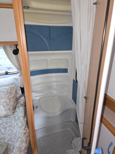 an open door of an rv with a toilet at Camperowe Swawole - Bondi in Bielawa