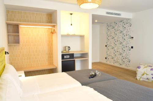 Postel nebo postele na pokoji v ubytování Hotel Pachico
