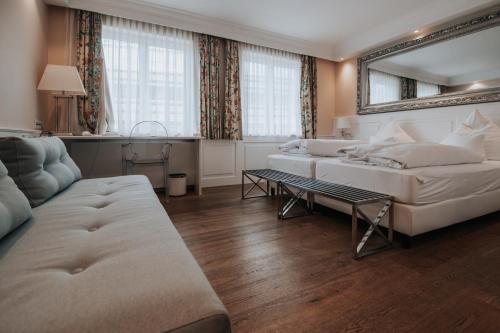Ένα ή περισσότερα κρεβάτια σε δωμάτιο στο Boutique Hotel am Rathaus - Reblaus