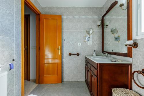a bathroom with a sink and a mirror at A&n Moriles, Torre del Mar in Torre del Mar