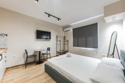 Ліжко або ліжка в номері Lucas Central Stylish Studio