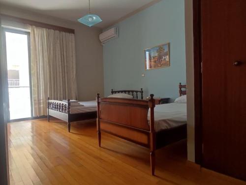 Postel nebo postele na pokoji v ubytování Οικογενειακό Διαμέρισμα με Θέα