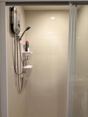 a shower stall in a bathroom with a shower at The Base Condo in Pattaya Central