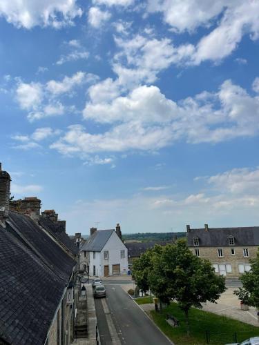 a view of a street in a town with houses at Gite - Val Couesnon in Saint-Ouen-de-la-Rouërie