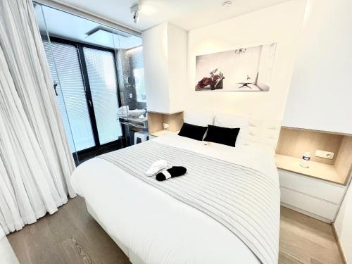 Postel nebo postele na pokoji v ubytování Luxury Suite Koksijde 102 Adult only!