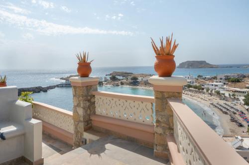 a balcony with a view of the ocean at Yani La Scala Luxury Villas in Lefkos Karpathou