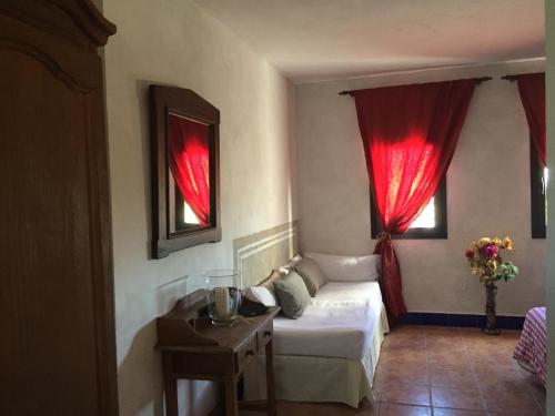 Postel nebo postele na pokoji v ubytování Cortijo Carrillo