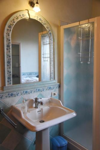 a bathroom with a sink and a shower at Casa Vacanze Vigna di Valle in Bracciano