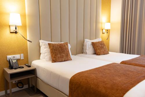 Katil atau katil-katil dalam bilik di MASA Hotel & Spa Campo Grande Collection