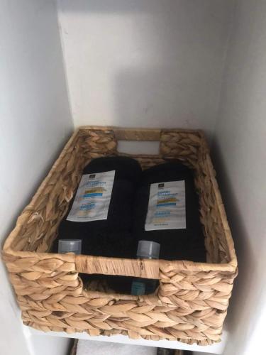 a wicker basket with two candles in it at Darsi suites Kythnos in Kithnos
