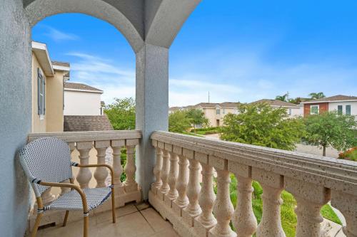 a chair on a balcony with a view at 7410 Marker Avenue in Orlando