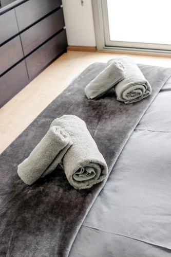 two towels laying on a bed in a room at Exclusiva Villa de Lujo con piscina in Canyelles