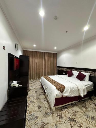 Cama o camas de una habitación en Nuzha Sqaure Hotel