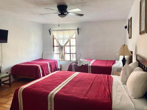 Postel nebo postele na pokoji v ubytování Hotel Socavon