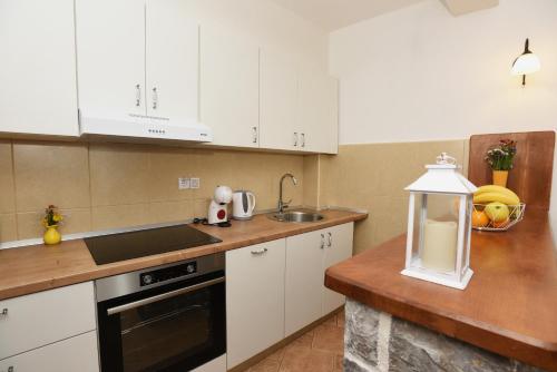 Kuchyň nebo kuchyňský kout v ubytování Apartman Old Pier