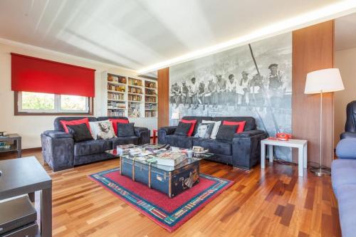 a living room with two couches and a table at Sweet Home Braga - 4 rooms apartment in Braga