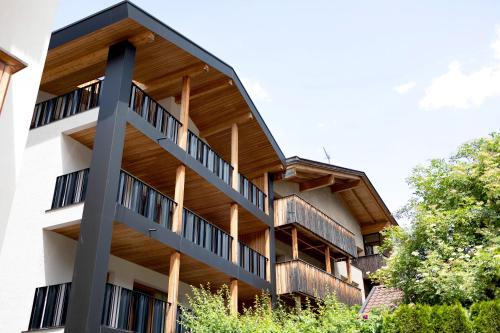 an external view of a building with wooden balconies at Kriendl Nr 4 in Valdaora