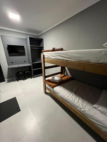 Katil atau katil-katil dalam bilik di Hospedagem Confortável e Prática para viajantes e férias - Próxima à BR-101