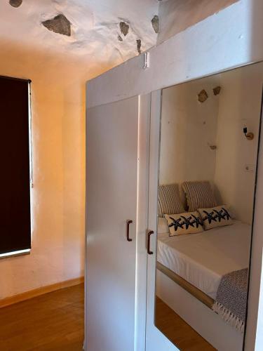 a bedroom with a bunk bed with a mirror at Altea Serenity in Altea