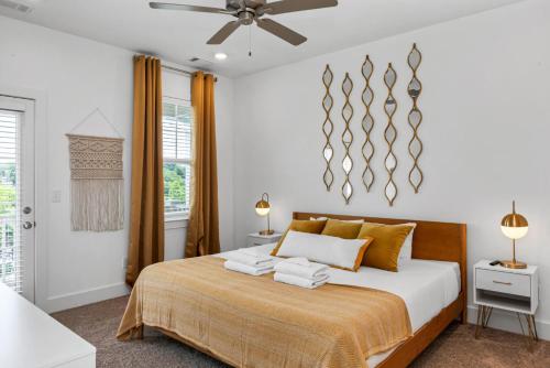 a bedroom with a bed and a ceiling fan at The Lakeside Landing in Nashville