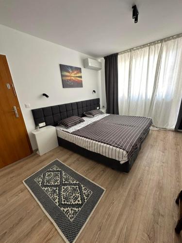 Ένα ή περισσότερα κρεβάτια σε δωμάτιο στο Manolovi Guest House