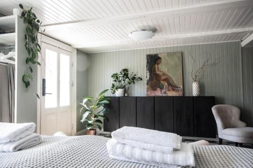 a bedroom with a bed and a painting on the wall at Johannas GuestHouse in Söderköping
