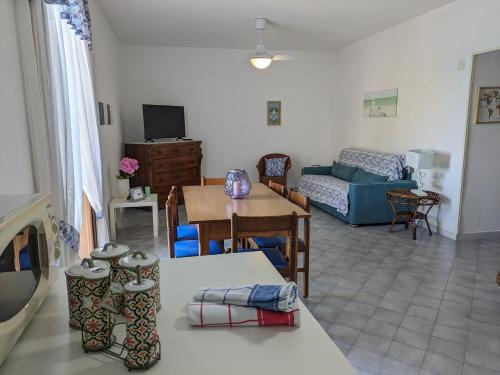 a living room with a couch and a table at Mim&igrave; sul Mare in Massa Lubrense