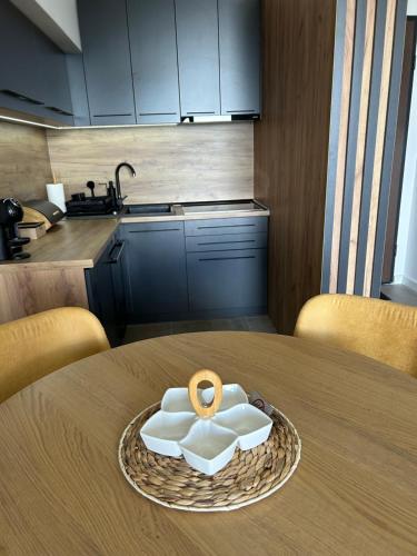a plate with a ring on top of a table at Divcibare Vrh 26 in Divčibare
