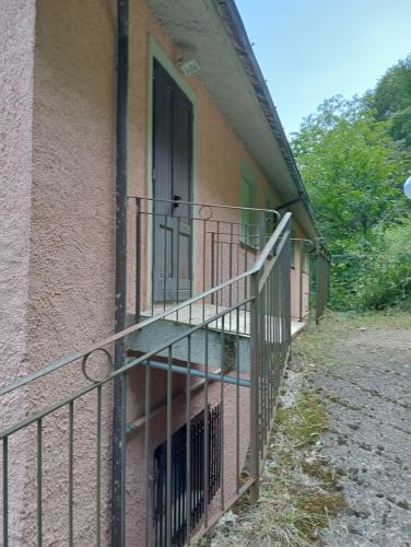 a balcony of a building with an open door at La Panoramica a Molino del Pallone in Molino del Pallone