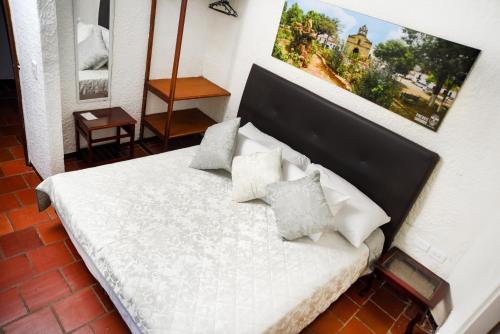 Hotel Posada Campestre San Gilにあるベッド