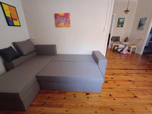 a couch in the middle of a living room at Lefkada Family Apartment in Lefkada Town