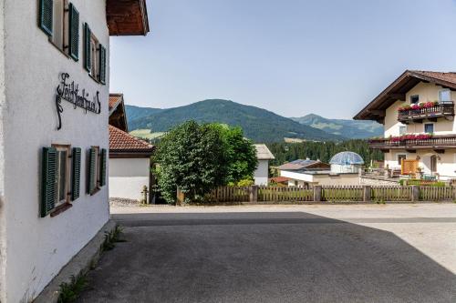 a building with graffiti on the side of a street at Feichtenhäusl app 2 in Westendorf