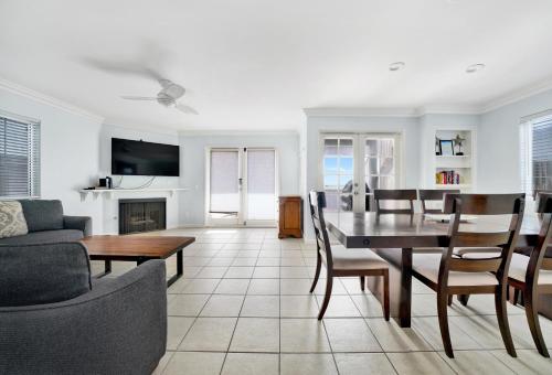 a living room with a table and a dining room at 1404 W Oceanfront A in Newport Beach