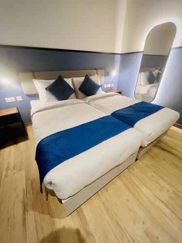 Ένα ή περισσότερα κρεβάτια σε δωμάτιο στο South32 Hotel